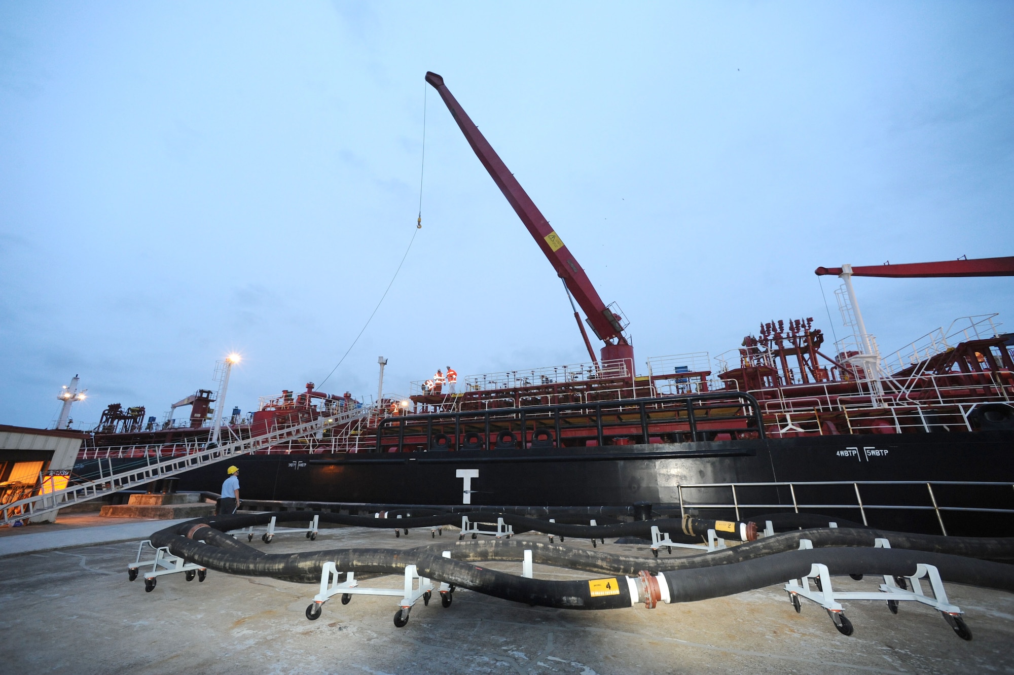 An oil vessel docks at the Praia Harbor to restock the base reservoirs, Nov. 17, 2010.  A team of 70 Airmen and their Portuguese partners ensured the transfer of more than 200,000 gallons of fuel, worth about $7 million.  (U.S. Air Force photo by Tech. Sgt. Chyrece Campbell)
