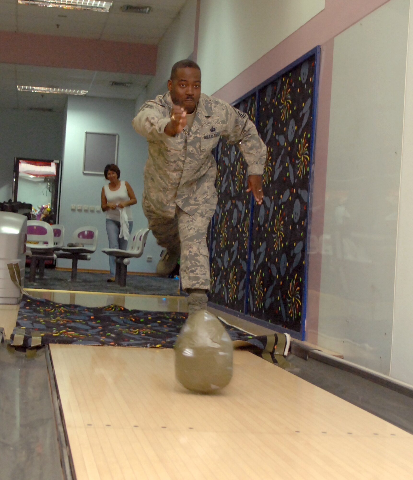 Chief Master Sgt. Marcus Snoddy, the 39th Air Base Wing command chief, puts his bowling skills to the test Nov. 12, 2010 at Incirlik Air Base, Turkey.  Chief Snoddy is participating in the bowling center’s first turkey toss.  Participants had to bowl a strike with a real 13 pound turkey in order to win a Thanksgiving bird.  Bowling center officials awarded three turkeys during the event, which had approximately 25 participants.  (U.S. Air Force photo by Tech. Sgt. Valda Wilson/Released)