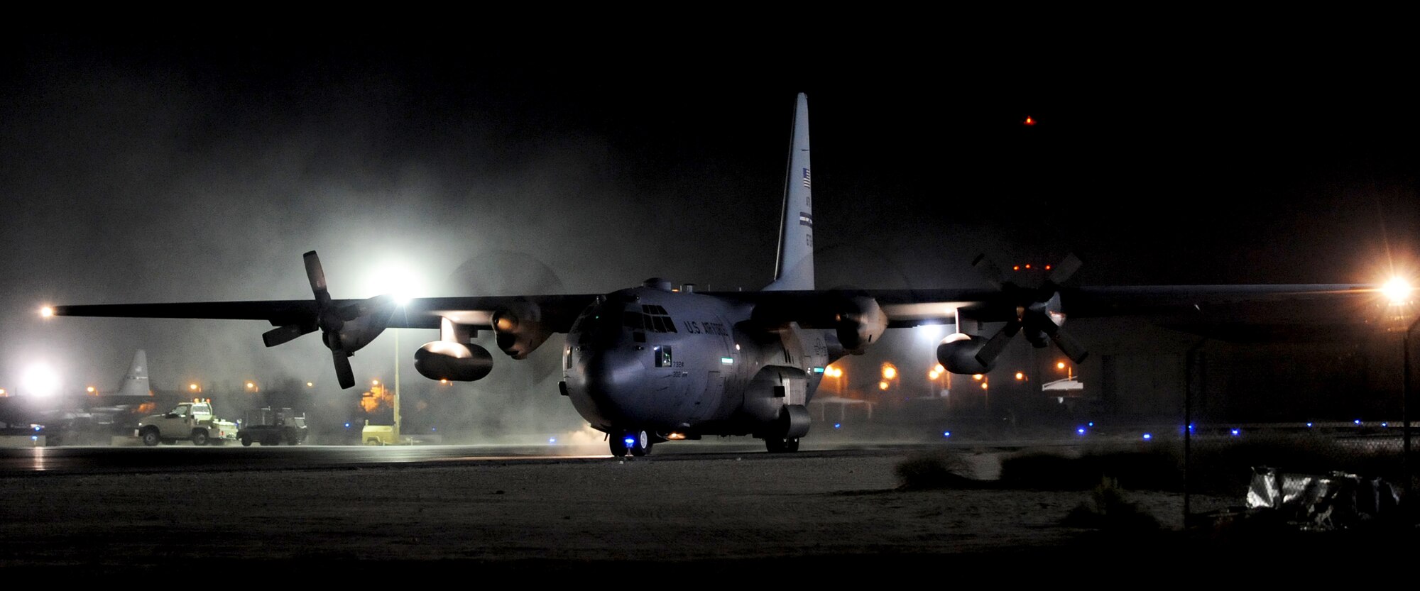 SOUTHWEST ASIA -- A C-130 Hercules taxis on the flight line of the 386th Air Expeditionary Wing after off-loading cargo at an undisclosed air base here Nov. 19, 2010. Night operations play a big role in the mission of the wing, which serves as the primary airlift hub for coalition forces in Iraq and provides theater airlift services across Southwest Asia. (U.S. Air Force photo by Senior Airman Laura Turner)