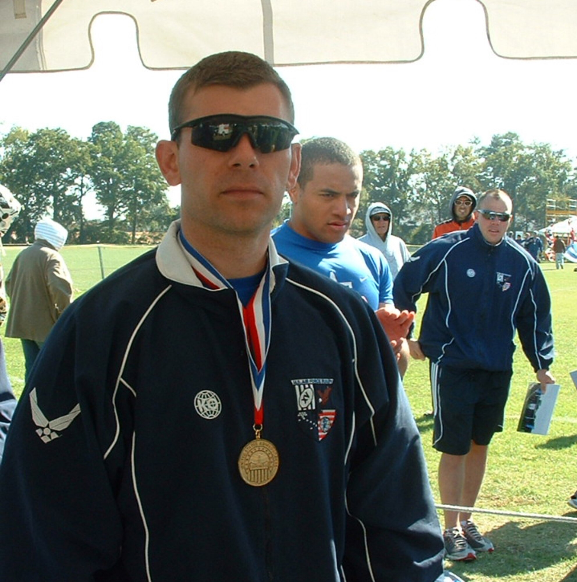 RAF MILDENHALL, England -- Tech. Sgt. Jammey Tipper-Booth, from the 100th Civil Engineer Squadron, proudly shows off his winning medal after competing in the Armed Forces Rugby Championships in Fort Benning, Ga., Nov. 1 to 7, 2010. The Air Force team won their seventh straight championship, defeating the Army, Navy, Marine Corps and Coast Guard along the way. (U.S. Air Force/ Capt. Reza Grigorian)