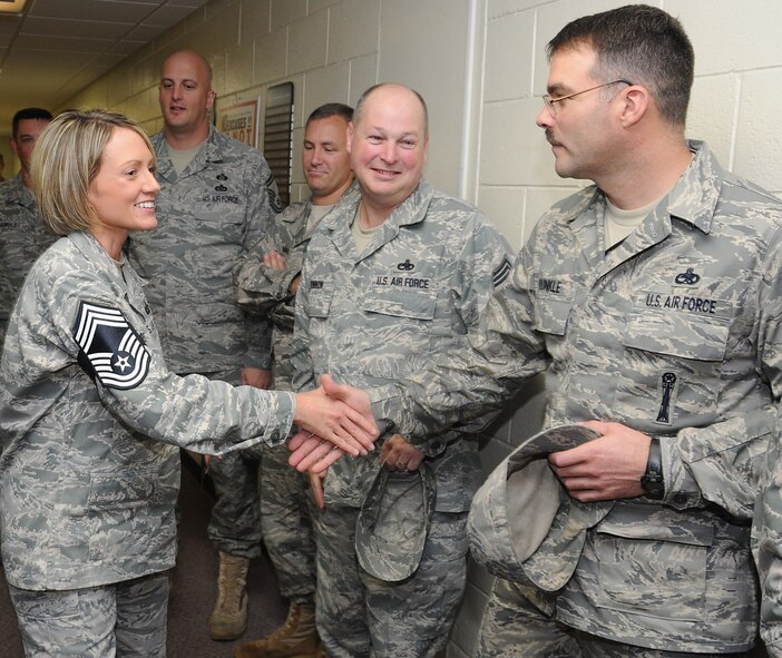 Senior Master Sgt. Valerie Bell, 18th Operations Support Squadron, is congratulated on her promotion to chief master sergeant by members of the Kadena Chief's Group shortly after Air Force officials announced the newest additions to the top enlisted rank Nov. 19. (U.S. Air Force photo/Staff Sgt. Darnell T. Cannady)