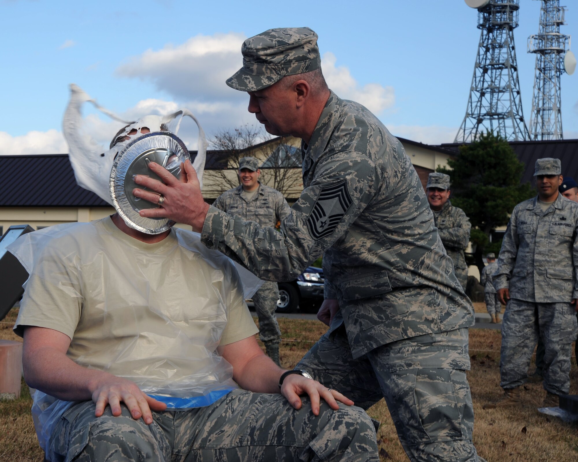 U.S. Air Force Chief Master Sgt. William Wilkinson, right, 35th Operations Group, slams a pie in the face of Lt. Col. Joseph McFall, left,  35th Operation Support Squadron, during Combined Federal Campaign fundraiser at Misawa Air Base, Japan, Nov. 18, 2010. Colonel McFall raised donations in $107.30. In total, the event brought in an additional $489.70 for the CFC. (U.S. Air Force photo by Tech. Sgt. Russell McBride/Released) 