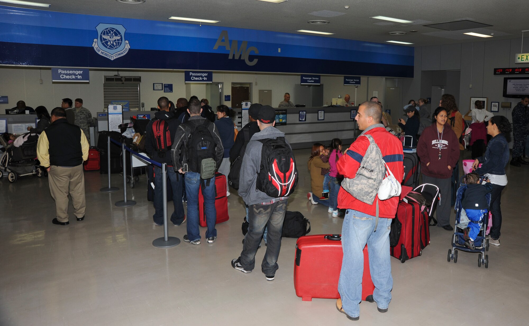 Misawa community members wait at the Patriot Express check-in counter at Misawa Air Base, Japan, Nov. 15, 2010. The Patriot Express leaves for Korea on Mondays and for Seattle on Tuesdays. (U.S. Air Force photo by Tech. Sgt. Russell McBride/Released)