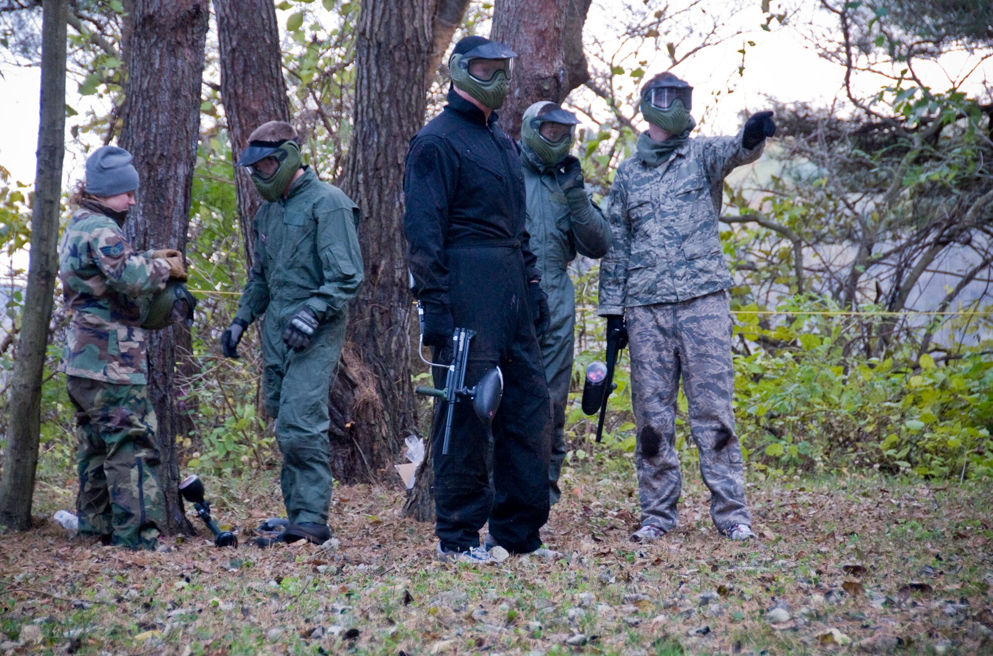 Members from the 35th Civil Engineer Squadron Explosive Ordnance Disposal Flight, and family members, take part in a paintball match, Nov. 10, 2010, during an annual EOD Safety Stand-down day at Misawa Air Base, Japan. The Air Force Headquarters-directed stand-down day, allows a deliberate pause in operations to allow EOD technicians to focus on compliance with standard operating procedures, tactics, techniques, and examine the health of their EOD career field. (U.S. Air Force photo by Senior Airman Jessica Lockoski)