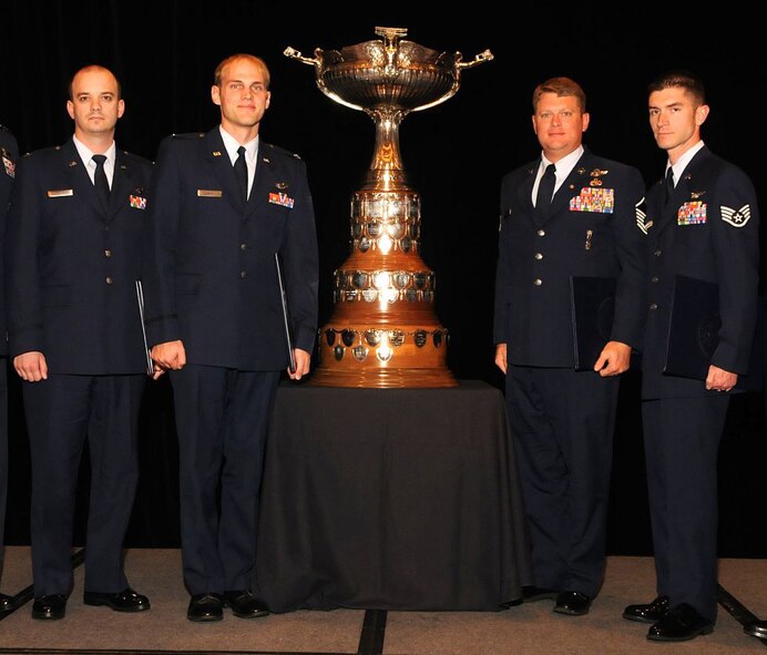 Capt. Robert Rosebrough, 1st Lt. Luke Will, Master Sgt. Dustin Thomas and Staff Sgt. Tim Philpott, all members of the 33rd Rescue Squadron, were presented the 2009 Mackay Trophy during the National Aeronautic Association Fall Awards Banquet in Arlington, Va. Nov. 8.  They received the award for flying an HH-60G Pavehawk under fire during rescue operations near Frontenac Forward Operating Base, Afghanistan on July 29, 2009. (Courtesy photo by National Aeronautic Association) 