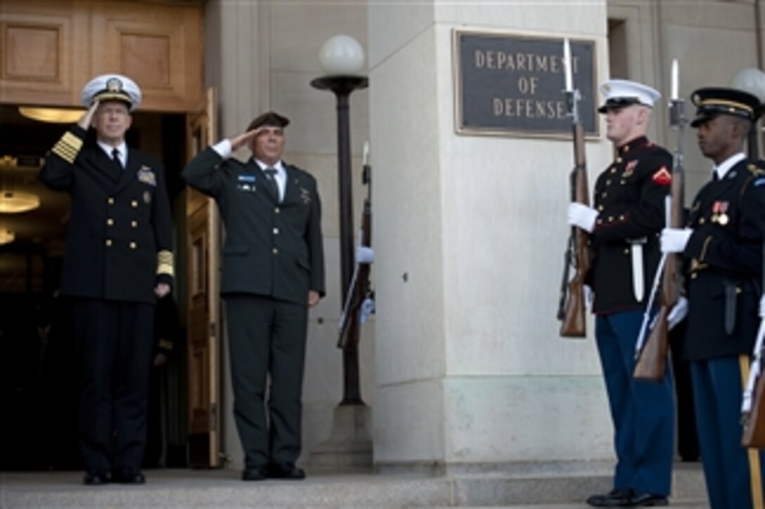 Chairman of the Joint Chiefs of Staff Adm. Mike Mullen, U.S. Navy, and Israeli Chief of Defense Lt. Gen. Gabi Ashkenazi salute during the respective playing of their national anthems during a ceremony welcoming Ashkenazi to the Pentagon on Nov. 17, 2010.  