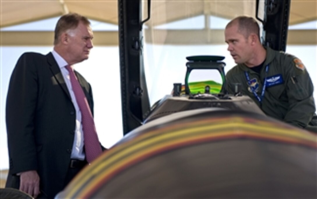 Deputy Secretary of Defense William J. Lynn III is given a mission brief of the F-16 Fighting Falcon jet fighter by Air Force Maj. Bryan Unks of the 309th Fighter Squadron while on the flight line of Luke Air Force Base, Ariz., on Nov. 17, 2010.  