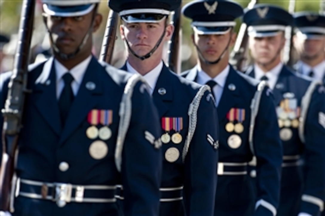Airmen with the Air Force Honor Guard at Bolling Air Force Base, Washington, D.C., perform during a Veteran’s Day parade in Las Vegas, Nev., on Nov. 11, 2010.  
