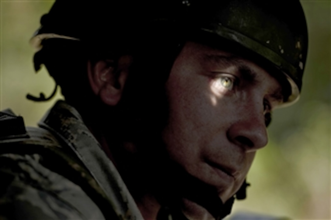 Senior Airman Daniel Horning rides in the lead Humvee during a convoy training operation at Camp Bullis, Texas, on Nov. 10, 2010.  The airmen attending the Combat Leadership Course gain experience from classroom and field training in convoy operations, mounted and dismounted patrols and urban warfare.  