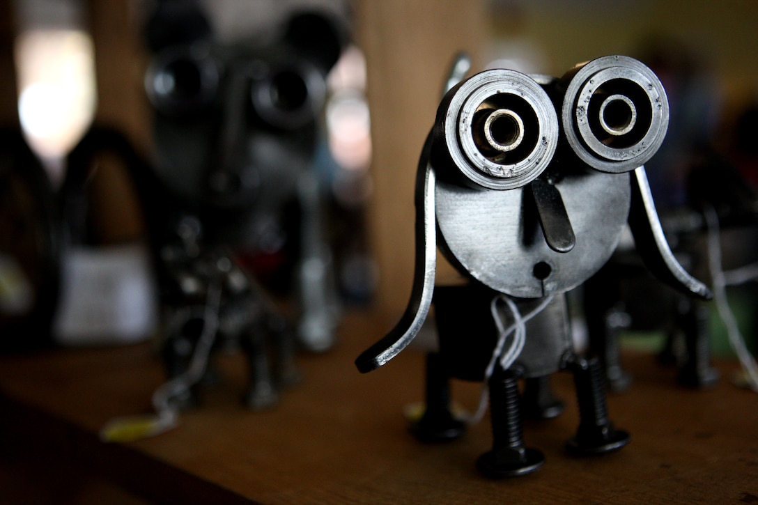 A metal dog, made from nuts, cotter pins, carriage bolts and other assorted scrap, sits on display during the biannual holiday craft fair hosted by the Hidden Talents craft store at the Paradise Point Officers' Club, Nov. 20 and 21. Local artisans come to this event, specializing in various craft projects from jewelry to woodwork to needlework, where locals are able to shop for gift ideas prior to holiday plans.