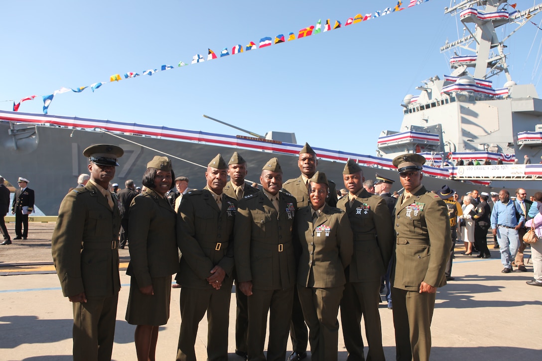 Members of the Marine Corps Base Camp Lejeune and Marine Corps Air Station New River chapters of the National Naval Officers’ Association take a moment to pose in front the ship after the commissioning ceremony of the Navy destroyer, USS Gravely, at the State Ports, Wilmington, N.C., Nov. 20. The destroyer was named after the late pioneer Vice Adm. Samuel Lee Gravely Jr., who was the first African-American in the U.S. Navy to be commissioned, first to serve aboard a fighting ship as an officer, the first to command a Navy ship, become a fleet commander and a flag officer.