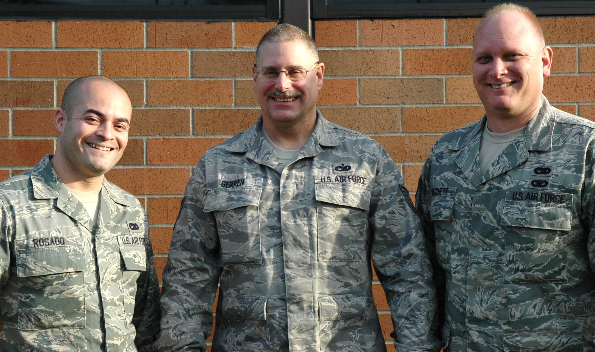 JOINT BASE LEWIS-MCCHORD, Wash. -- (From left to right) Staff Sgt. Luis Rosado, a ramp specialist with the 36th Aerial Port Squadron here, Tech. Sgt. Richard Gerren, 36th APS inspector, and Staff Sgt. Michael Pritchett, 36th APS ramp specialist are preparing to deploy to Bagram Airfield, Afghanistan.  The Reservists volunteered to support the air mobility effort in the war's cargo hub, while assigned to the 455th Expeditionary Aerial Port Squadron at Bagram Airfield. (U.S. Air Force photo/Staff Sgt. Elizabeth Moody)  