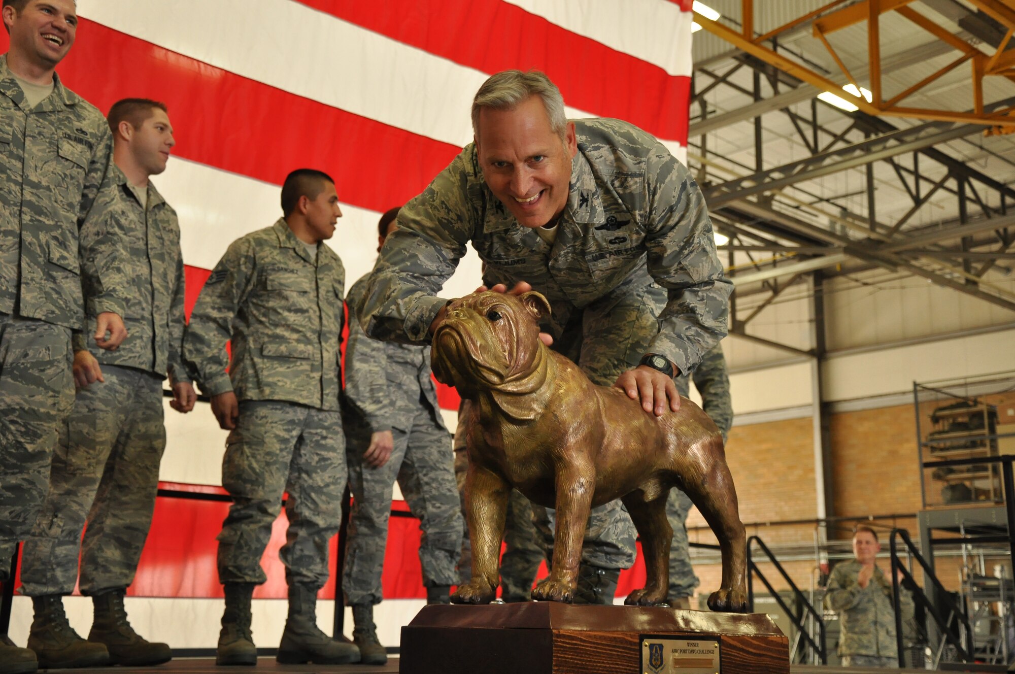 Colonol Mark Vijums, 934th Airlift Wing Vice Commander Poses with "Chesty" the trophy won by members of the Arial port Squadron for the first DAWGS competition at Dobbins ARB Gerorgia. (Air Force Photo/TSgt Bob Sommer)