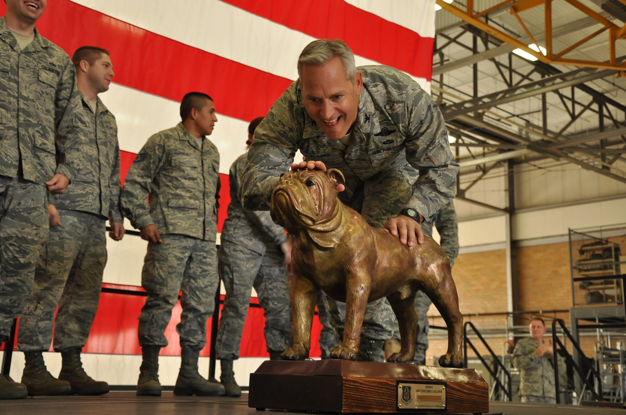 Colonol Mark Vijums, 934th Airlift Wing Vice Commander Poses with "Chesty" the trophy won by members of the Arial port Squadron for the first DAWGS competition at Dobbins ARB Gerorgia. (Air Force Photo/TSgt Bob Sommer)