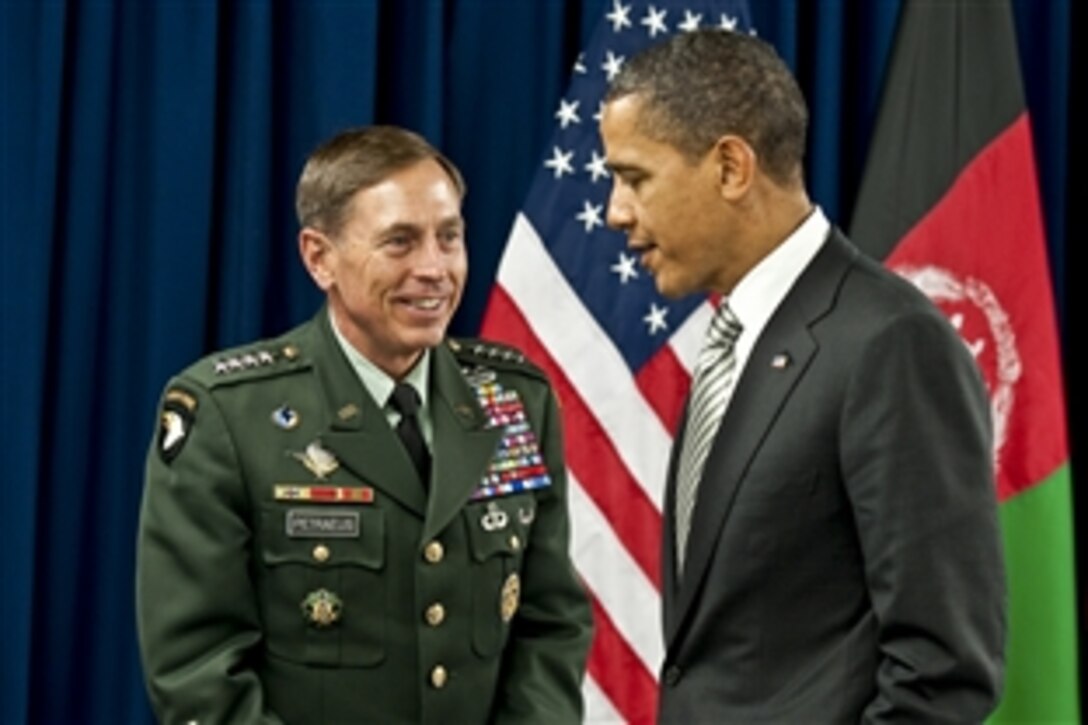 U.S. President Barack Obama and U.S. Army Gen. David H. Petraeus, commander of International Security Assistance Forces and NATO Troops in Afghanistan, chat between meetings during the NATO Summit in Lisbon, Portugal, Nov. 20, 2010. 