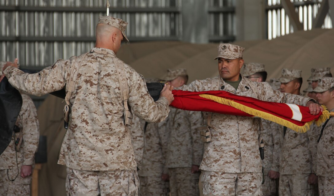 Lt. Col. Daniel Shipley, the commanding officer of Marine Fighter Attack Squadron 232, 3rd Marine Aircraft Wing (Forward), and Sgt. Maj. Rodolfo Sarino, the squadron sergeant major, case the VMFA-232 squadron colors during a Transfer of Authority ceremony held at Kandahar Air Field, Afghanistan, Nov. 20.  VMFA-232 relinquished their area of responsibility to VMFA-122, after having supported coalition forces in Helmand and Nimroz provinces for the past six months.