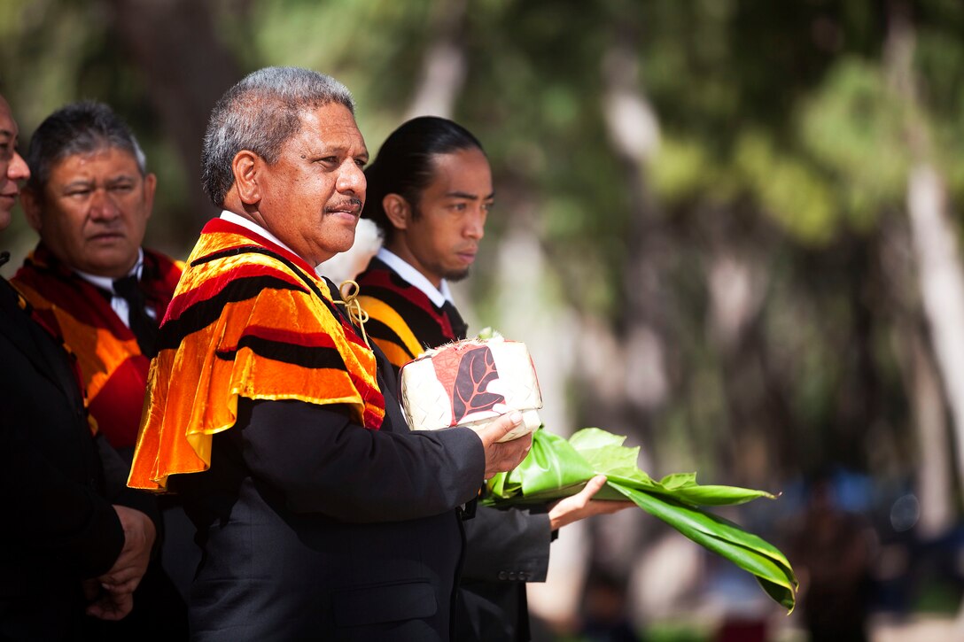 Members of the Royal Order of Kamehameha prepare for their procession during a Makahiki festival at Bellows Air Force Station in Waimanalo, Hawaii, Nov. 20, 2010. Lasting from October until February, the Makahiki season honors the Hawaiian god Lono, the guardian of peace and health, as he arrives for the transition from Ku, a time of war, politics and construction, to Lono, a time of relaxation and celebration of life.