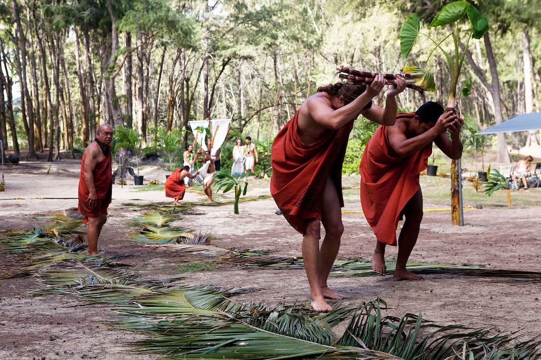 Members of a ceremonial procession present gifts to the Hawaiian god Lono during the hookupu protocol presentation of a Makahiki festival at Bellows Air Force Station in Waimanalo, Hawaii, Nov. 20, 2010. Lasting from October until February, the Makahiki season honors Lono, the guardian of peace and health, as he arrives for the transition from Ku, a time of war, politics and construction, to Lono, a time of relaxation and celebration of life.