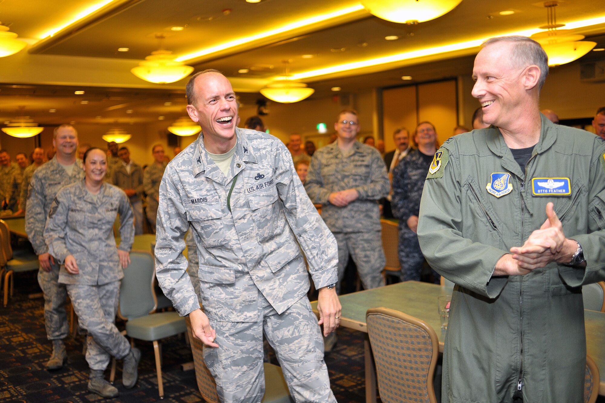YOKOTA AIR BASE, Japan -- Col. Christopher Mardis, 374th Maintenance Group commander, congratulates the seven senior master sergeants assigned to Yokota Air Base who were among the 504 selected Air Force-wide for promotion to chief master sergeant Nov. 19 during the wing's Chief Master Sgt. Promotion Selection Celebration. (U.S. Air Force photo/Osakabe Yasuo)