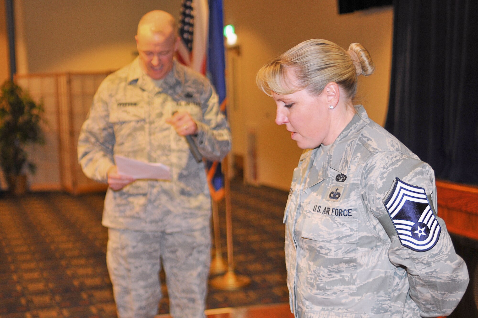 YOKOTA AIR BASE, Japan -- Seven senior master sergeants assigned to Yokota Air Base were among the 504 Airmen selected Air Force wide for promotion to chief master sergeant, personnel officials announced Thursday morning, Nov. 18. Chief Master Sgt. Thomas Pfeffer (back), U.S. Forces Japan, announces his wife, Senior Master Sgt. Sandra Pfeffer, 5th Air Force, as a Chief Master Sergeant select, Nov. 19 during the Wing's Chief Master Sgt. Promotion Selection Celebration. (U.S. Air Force photo/Osakabe Yauso)