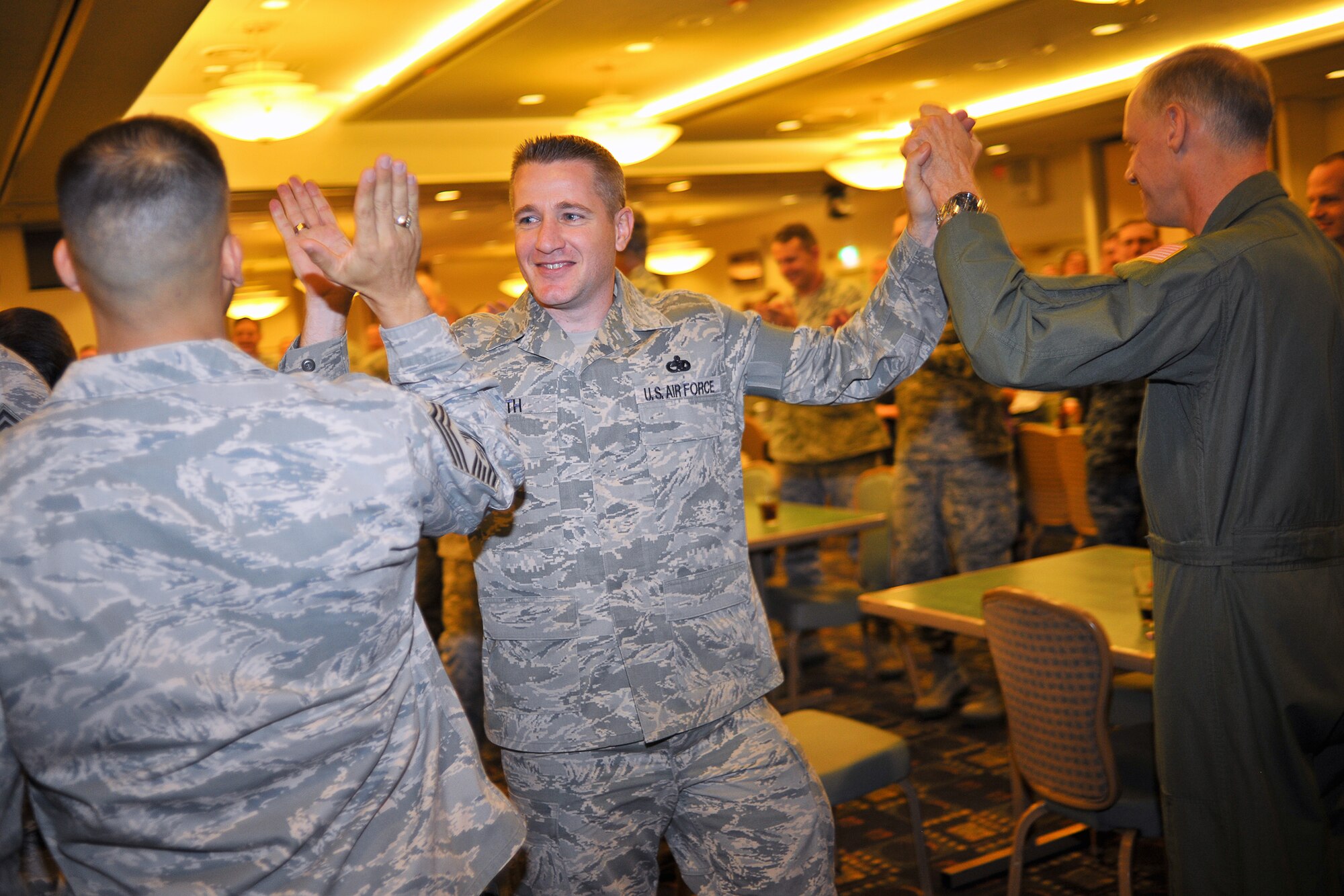 YOKOTA AIR BASE, Japan -- Yokota leaders congratulate Chief Master Sgt. (sel) Scott Smith, 374th Maintenance Squadron, Nov. 19 during the Wing's Chief Master Sgt. Promotion Selection Celebration.  Seven senior master sergeants assigned to Yokota Air Base are among the 504 selected Air Force wide for promotion to chief master sergeant, personnel officials announced Thursday morning, Nov. 18.  (U.S. Air Force photo/Osakabe Yasuo)