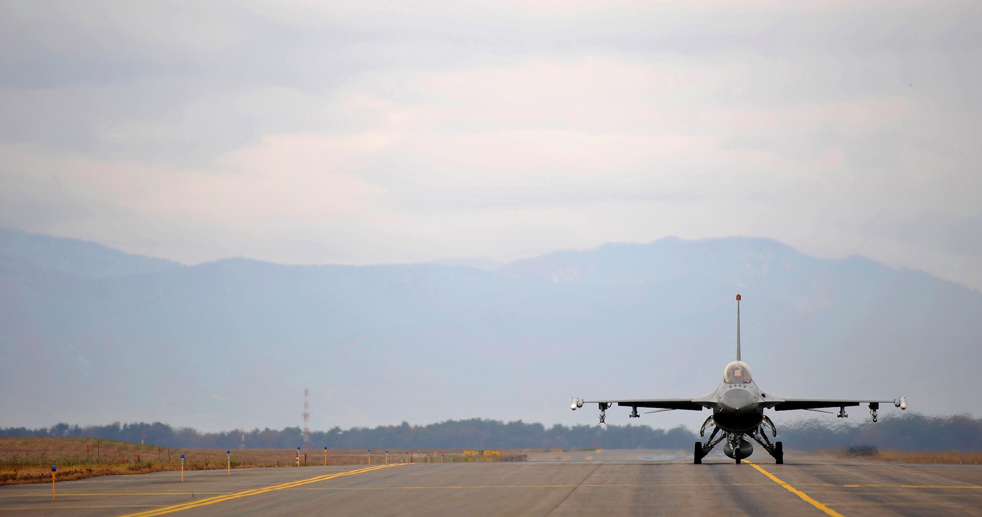 An F-16 Fighting Falcon taxis to the end of the runway for inspection at Misawa Air Base, Japan, Nov. 19, 2010. The primary purpose of an EOR inspection is to arm the jet. (U.S. Air Force photo by Staff Sgt. Chad C. Strohmeyer/Released)