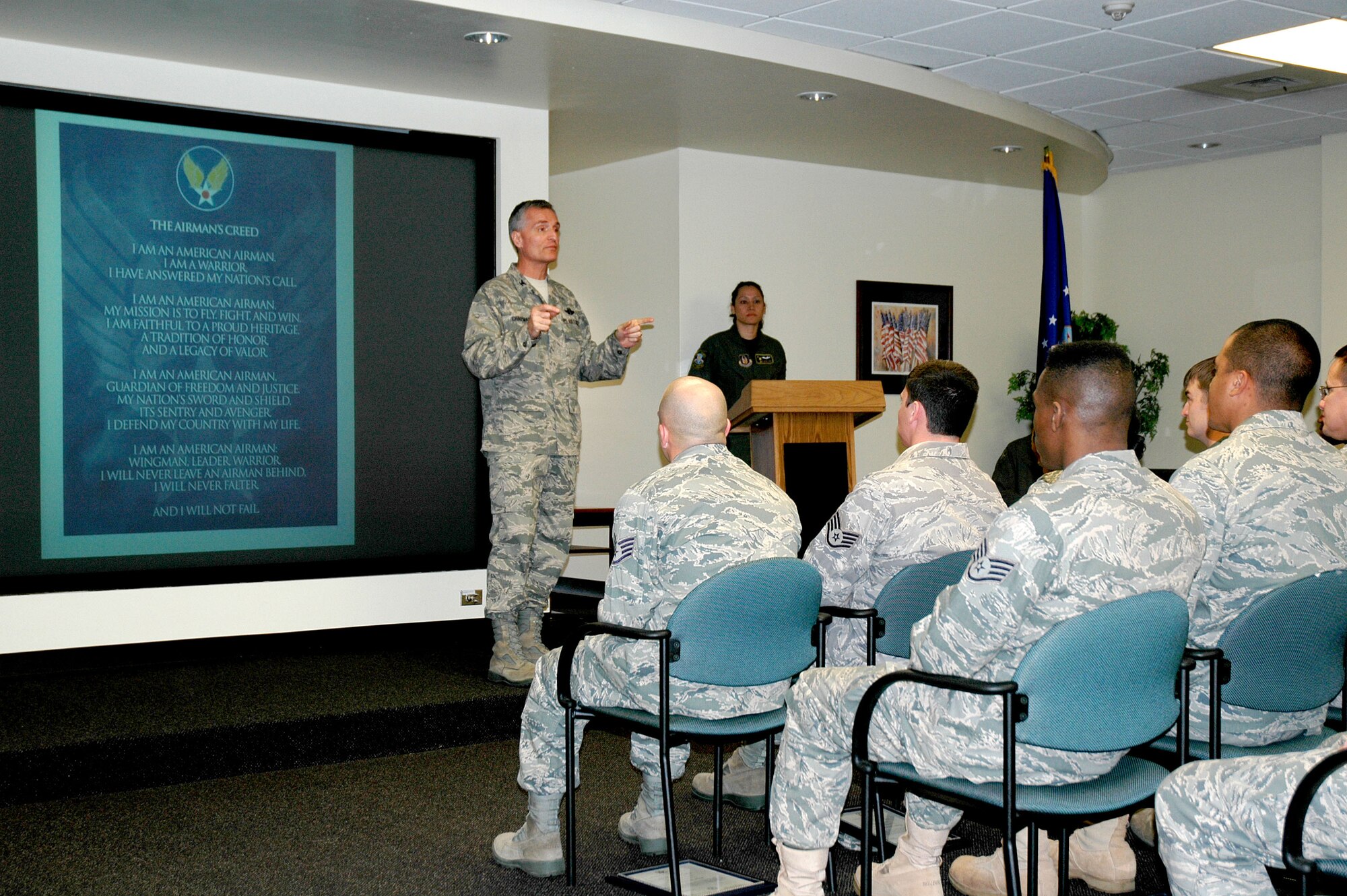 Col. Steven Chapman addresses the 315th Airlift Wing's newest staff and master sergeants at an induction ceremony held November 20, 2010 at the 315 AW auditorium. Thirteen Airmen were promoted staff sergeants and nine noncommissioned officers were inducted into the senior NCO ranks. (U.S. Air Force photo/Capt. Bryan Lewis)