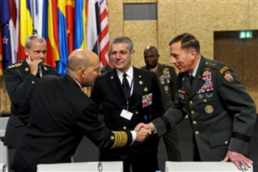 U.S. Navy Adm. James G. Stavridis, left, NATO's supreme allied commander for Europe; Italian Navy Adm. Giampaolo di Paola, NATO's military committee chairman, and U.S. Army Gen. David H. Petraeus, commander, International Security Assistance Force, meet at the NATO-Russia Council Summit in Lisbon, Portugal, Nov. 20, 2010.