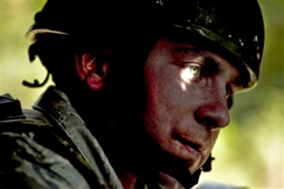 U.S. Air Force Senior Airman Daniel Horning rides in the lead Humvee for a convoy training operation during a combat leadership course on Camp Bullis, Texas, Nov. 10, 2010. The airmen attending the course gain experience from classroom and field training in convoy operations, mounted and dismounted patrols, and urban warfare.