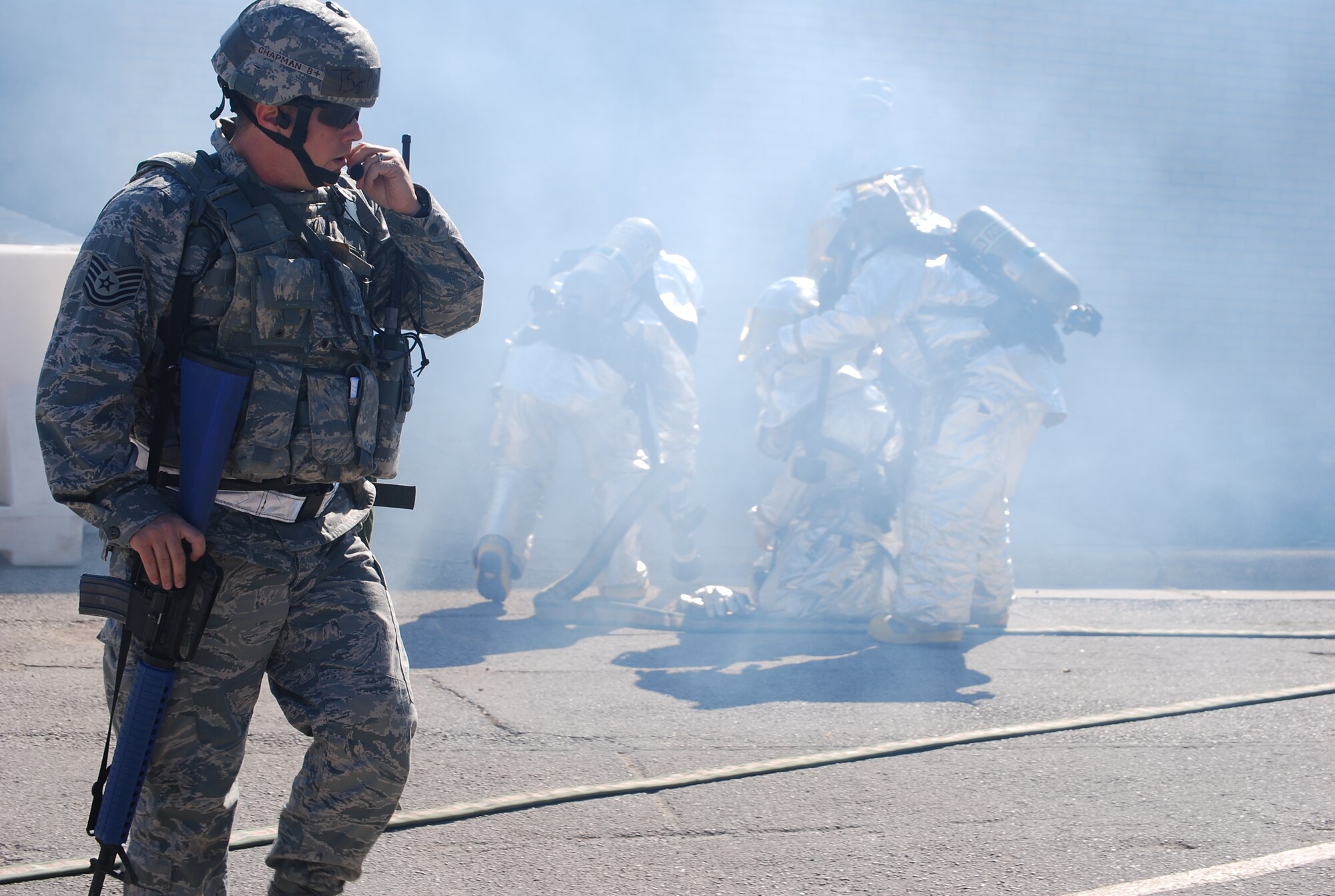 Airmen of the 433rd Airlift Wing demonstrated their capabilites at the recent ORE. Security Forces and Firefighters working together secured an area under attack and put out a simulated fire during the ORE. (U.S. Air Force Photo/Tech. Sgt. Carlos Trevino)