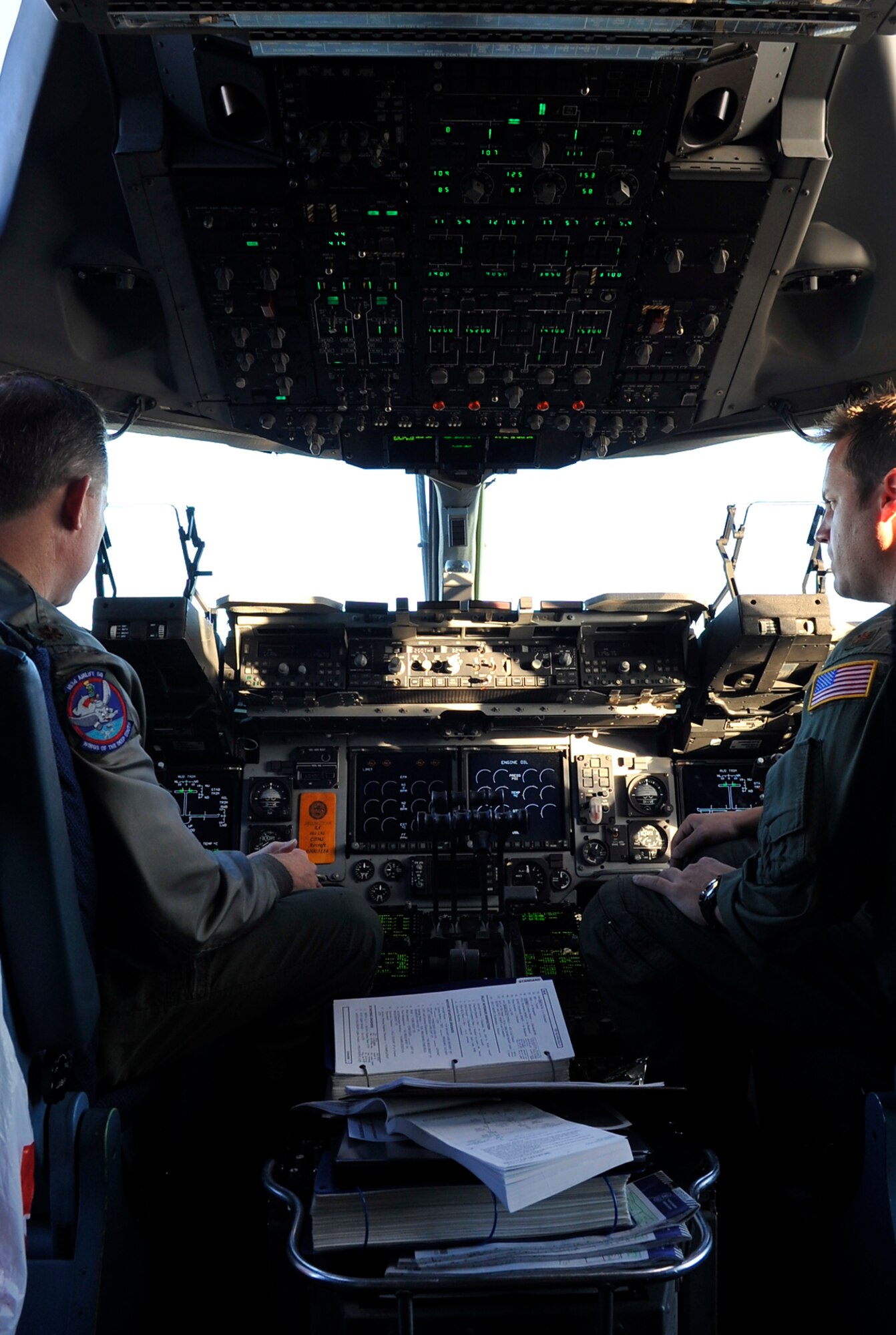 Maj Josh Glenn (Left), 183rd Airlift Squadron, Maj John Wilkinson (Right),183rd Airlift Squadron, performs an flight check before take off from Buckley AFB, Colo, Nov. 22, 2010. Generous donations came from organizations such as the National Ski Areas Association, Hope Seeds, the U.S. Olympic Committee.(U.S. Air Force photo by Airman 1st Class Paul Labbe.)