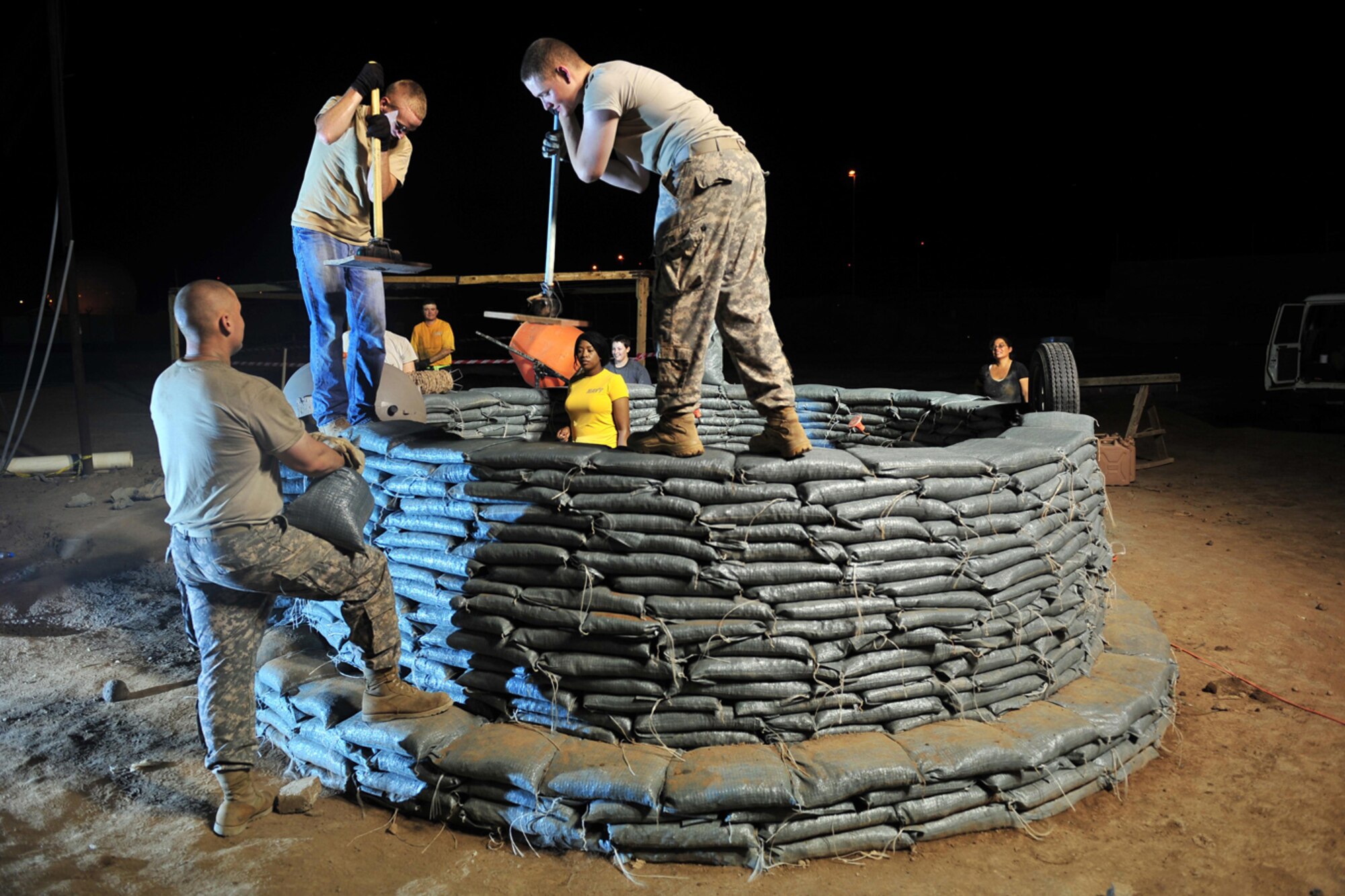 Members of Combined Joint Task Force-Horn of Africa and the 418th Civil Affairs Battalion construct an Eco-Dome prototype Aug. 27, 2010, at Camp Lemonnier, Djibouti. The Eco-Dome provides comfortable, economical and sustainable building solutions for impoverished and natural disaster stricken-areas. The goal of the task force is to help African nations build capability so they can promote regional security and stability, prevent conflict and protect U.S. and coalition interests. (U.S. Air Force photo/Staff Sgt. Kathrine McDowell)