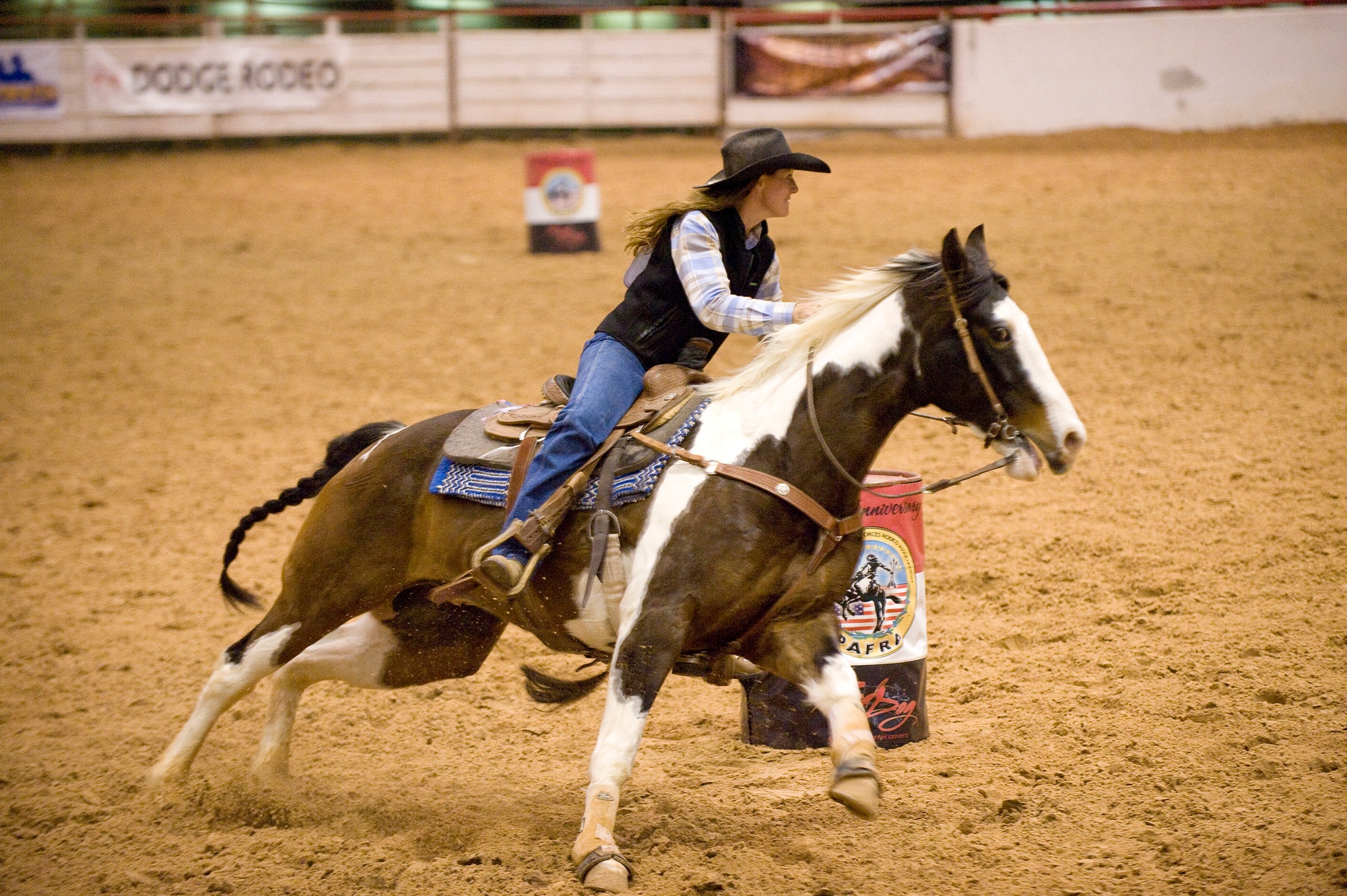 Lt. Col. Val Baker rounds the second barrel during the timed barrel racing competition at the Professional Armed Forces Rodeo Associations World Finals Nov. 20, 2010, in Glen Rose, Texas. Colonel Baker is stationed at Fort Huachuca, Ariz., and earned first place in the Woman's All-Around winning top honors in the rodeo while competing in five events. (U.S. Air Force photo/Master Sgt. Jack Braden)
