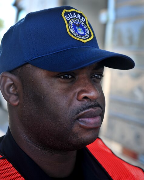 MOODY AIR FORCE BASE, Ga. -- Lamichael Doss, Department of the Air Force security guard lets a semi truck pass through the gate during a normal duty day Nov 22. Mr. Doss has worked the Moody gate since 2005 and said he is excited to be back working the gates to help defend the base. (U.S. Air Force photo/Airman 1st Class Joshua Green)(RELEASED)
