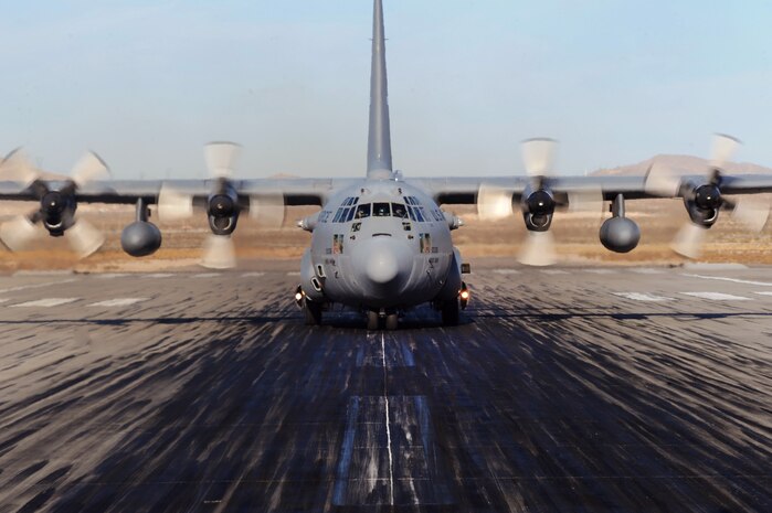NELLIS AIR FORCE BASE, Nev.-- A U.S. Air Force C-130 Hercules aircraft taxis down the Nellis runway Nov. 17 after a Mobility Air Forces Exercise held at the Nevada Test and Training Range. Approximately 40 C-17 Globemaster and C-130 Hercules cargo aircraft assembled in aerial formations over the NTTR to conduct air and ground operations as part of the bi-annual U.S. Air Force Weapons School MAFEX. (U.S. Air Force photo/ Master Sgt. Kevin J. Gruenwald)