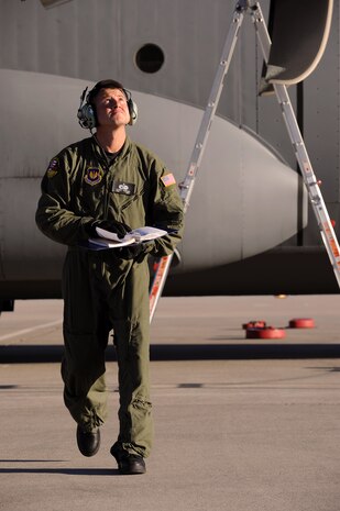 NELLIS AIR FORCE BASE, Nev. --  Tech. Sgt. Nathan McAdams, flying crew chief with the 86th Aircraft Maintenance Squadron, Rammstein Air Force Base, checks the engine intakes of a C-130 Hercules during the Mobility Air Forces Exercise held over the Nevada Test and Training Range,  Nov 17. Approximately 40 C-17 Globemaster and C-130 Hercules cargo aircraft will assemble in aerial formations over the NTTR to conduct air and ground operations as part of the bi-annual, U.S. Air Force Weapons School Mobility Air Forces Exercise. (U.S. Air Force Photo by Senior Airman Brett Clashman)(Released)