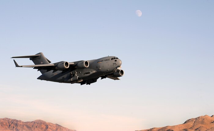NELLIS AIR FORCE BASE, Nev. --  A C-17 Globemaster III departs from Nellis Air Force Base during the Mobility Air Forces Exercise held over the Nevada Test and Training Range,  Nov 17. Approximately 40 C-17 Globemaster and C-130 Hercules cargo aircraft will assemble in aerial formations over the NTTR to conduct air and ground operations as part of the bi-annual, U.S. Air Force Weapons School Mobility Air Forces Exercise. (U.S. Air Force Photo by Senior Airman Brett Clashman)(Released)