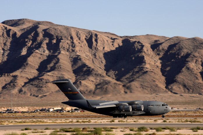NELLIS AIR FORCE BASE, Nev.--  A C-17 Globemaster III from the 97th Air Mobility Wing, Altus Air Force Base, Okla., arrives at Nellis for a Mobility Air Forces Exercise Nov 17. More than 40 C-17 Globemaster III and C-130 Hercules cargo aircraft assembled in aerial formations over the Nevada Test and Training Range to conduct air and ground operations as part of the bi-annual U.S. Air Force Weapons School MAFEX. (U.S. Air Force photo by Senior Airman Brett Clashman)