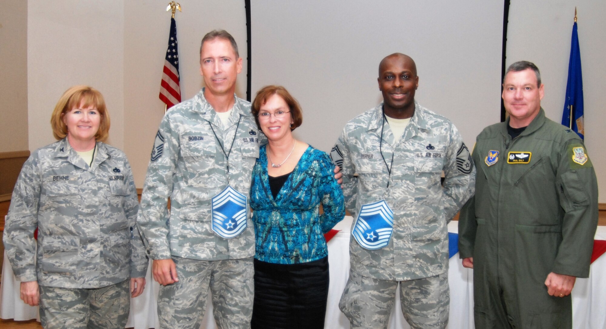 Left to right, Col. Mary A. Behne, 412th Maintenance Group commander; Chief Master Sgt. (Sel) Gregory B. Bobzin, 412th Aircraft Maintenance Squadron; Mrs. JoDee Bobzin; Chief Master Sgt. (Sel) Tony Turner, Air Force Operational Test and Evaluation Center, Detachment 5, and Col. Paul S. Daly, AFOTEC, Det. 5 commander. (Air Force photo by Stephen K. Robinson)