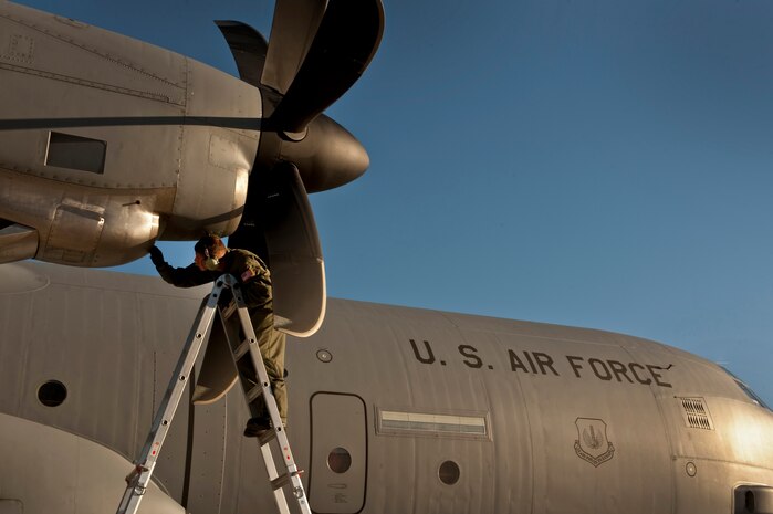 NELLIS AIR FORCE BASE, Nev. --  Tech. Sgt. Nathan McAdams, flying crew chief with the 86th Aircraft Maintenance Squadron, Ramstein Air Force Base, Germany conducts post flight checks of a C-130 Hercules  engine intake after landing at Nellis during the Mobility Air Forces Exercise held over the Nevada Test and Training Range,  Nov 17. Approximately 40 C-17 Globemaster and C-130 Hercules cargo aircraft will assemble in aerial formations over the NTTR to conduct air and ground operations as part of the bi-annual, U.S. Air Force Weapons School Mobility Air Forces Exercise.  (U.S. Air Force photo by Tech. Sgt. Michael R. Holzworth)(Released)