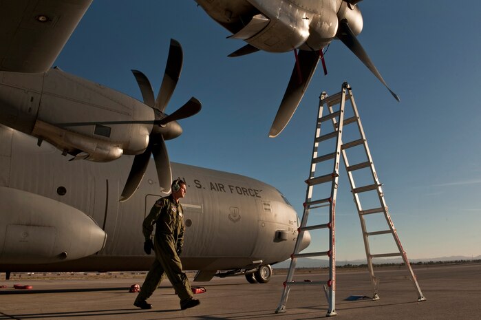 NELLIS AIR FORCE BASE, Nev.--  Tech. Sgt. Nathan McAdams, a flying crew chief with the 86th Aircraft Maintenance Squadron, Ramstein Air Base, Germany, checks the engine intakes of a C-130 Hercules during a Mobility Air Forces Exercise Nov. 17. More than 40 C-17 Globemaster III and C-130 Hercules cargo aircraft assembled in aerial formations over the Nevada Test and Training Range to conduct air and ground operations as part of the bi-annual U.S. Air Force Weapons School MAFEX. (U.S. Air Force photo by Tech. Sgt. Michael R. Holzworth)