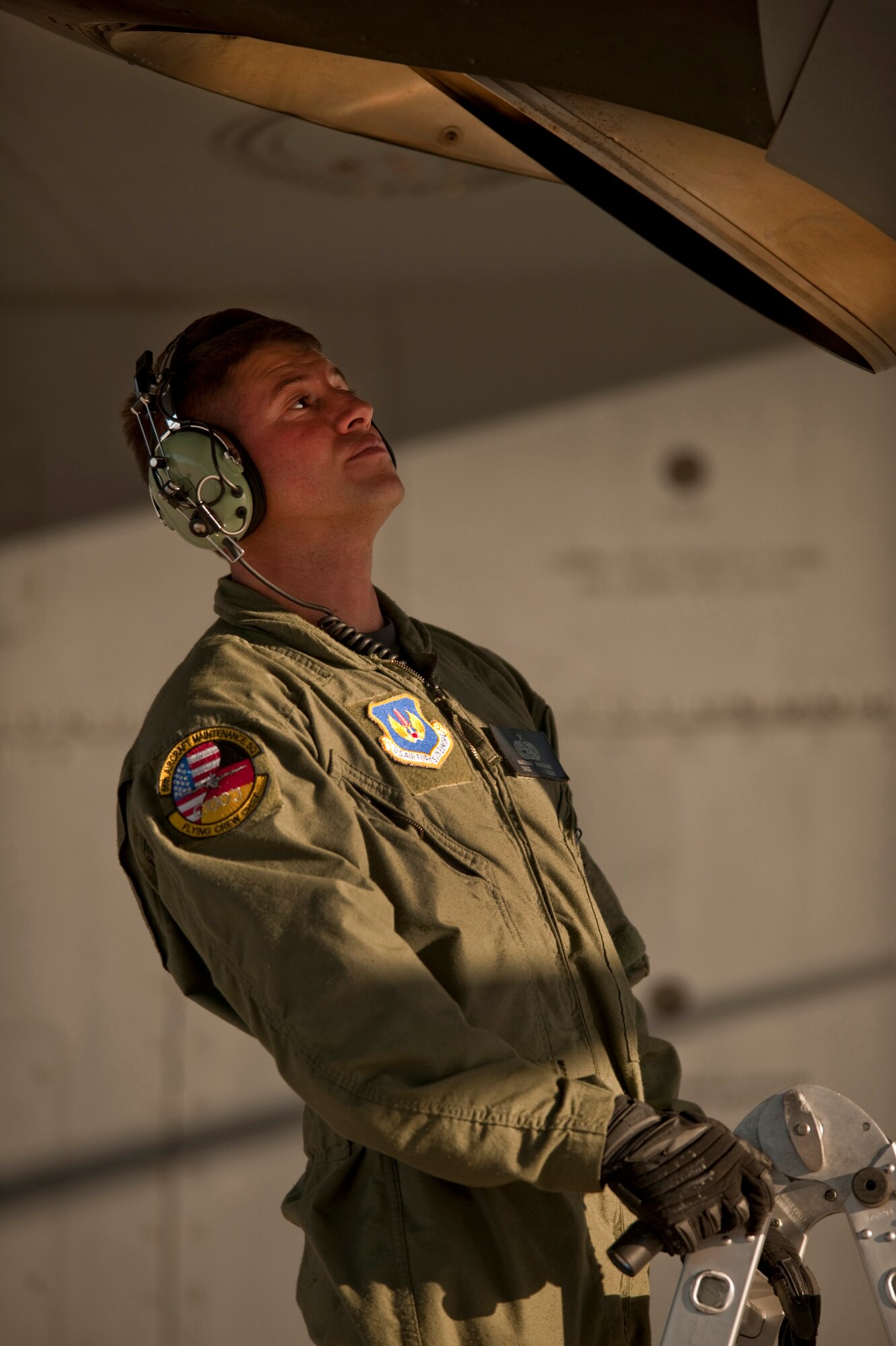 NELLIS AIR FORCE BASE, Nev. --  Tech. Sgt. Nathan McAdams, flying crew chief with the 86th Aircraft Maintenance Squadron, Ramstein Air Force Base, Germany conducts post flight checks of a C-130 Hercules engine exhausts after landing at Nellis during a Mobility Air Forces Exercise held over the Nevada Test and Training Range,  Nov 17. Approximately 40 C-17 Globemaster and C-130 Hercules cargo aircraft will assemble in aerial formations over the NTTR to conduct air and ground operations as part of the bi-annual, U.S. Air Force Weapons School Mobility Air Forces Exercise.  (U.S. Air Force photo by Tech. Sgt. Michael R. Holzworth)(Released)

