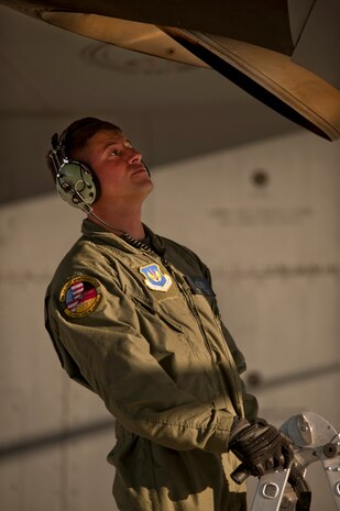 NELLIS AIR FORCE BASE, Nev. --  Tech. Sgt. Nathan McAdams, flying crew chief with the 86th Aircraft Maintenance Squadron, Ramstein Air Force Base, Germany conducts post flight checks of a C-130 Hercules engine exhausts after landing at Nellis during a Mobility Air Forces Exercise held over the Nevada Test and Training Range,  Nov 17. Approximately 40 C-17 Globemaster and C-130 Hercules cargo aircraft will assemble in aerial formations over the NTTR to conduct air and ground operations as part of the bi-annual, U.S. Air Force Weapons School Mobility Air Forces Exercise.  (U.S. Air Force photo by Tech. Sgt. Michael R. Holzworth)(Released)