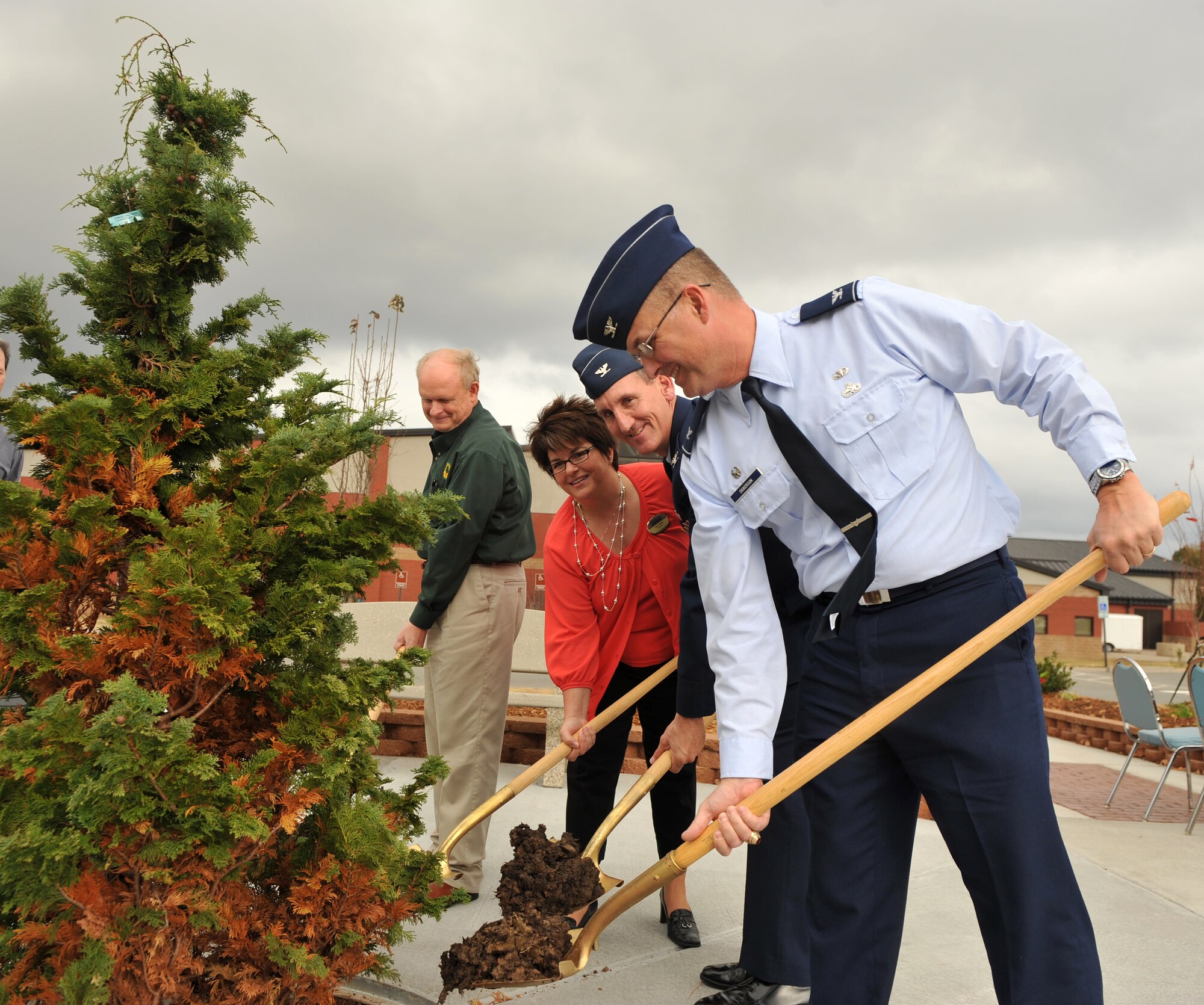 (From left) Larry Nance, Arkansas Forestry Commission deputy state forester, Lisa Stone, 19th Force Support Squadron deputy, Col. George Coggins, 19th Mission Support Group commander, and Col. Adam Dickerson, 314th Maintenance Group commander, plant a tree Nov. 22, 2010, for Arbor Day at Little Rock Air Force Base, Ark. Arbor Day is celebrated at the base in the fall because it allows the trees more time to stabilize from the transplanting and to grow roots before the heat of summer sets in. (U.S. Air Force photo by Senior Airman Gul Crockett)