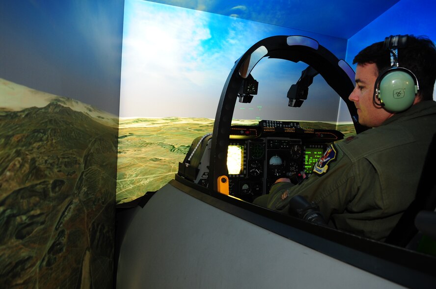 MOODY AIR FORCE BASE, Ga.-- Maj. Joseph Runci, 74th Fighter Squadron A-10C Thunderbolt II  pilot, uses the Full Mission Trainer, an A-10 cockpit simulator, in preparation for Green Flag West 11-02 Nov. 22. Several support personnel, maintainers and pilots will be traveling to Nellis Air Force Base, Nev., to participate in this year's Green Flag West exercise. (U.S. Air Force photo/Senior Airman Stephanie Longoria)(RELEASED)