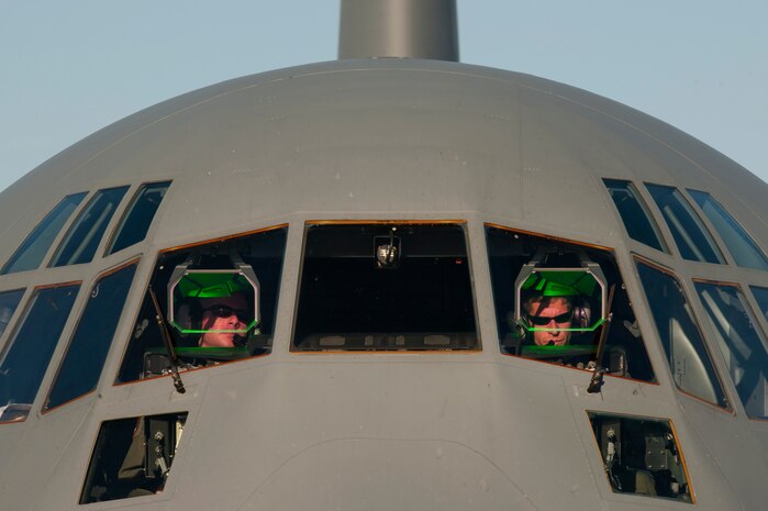 NELLIS AIR FORCE BASE, Nev.-- C-130 Hercules pilots from Little Rock Air Force Base, Ark., go over a post-flight check as they taxi to a stop on the Nellis flightline during a Mobility Air Forces Exercise Nov 17. More than 40 C-17 Globemaster III and C-130 Hercules cargo aircraft assembled in aerial formations over the Nevada Test and Training Range to conduct air and ground operations as part of the bi-annual U.S. Air Force Weapons School MAFEX. (U.S. Air Force photo by Tech. Sgt. Michael R. Holzworth)