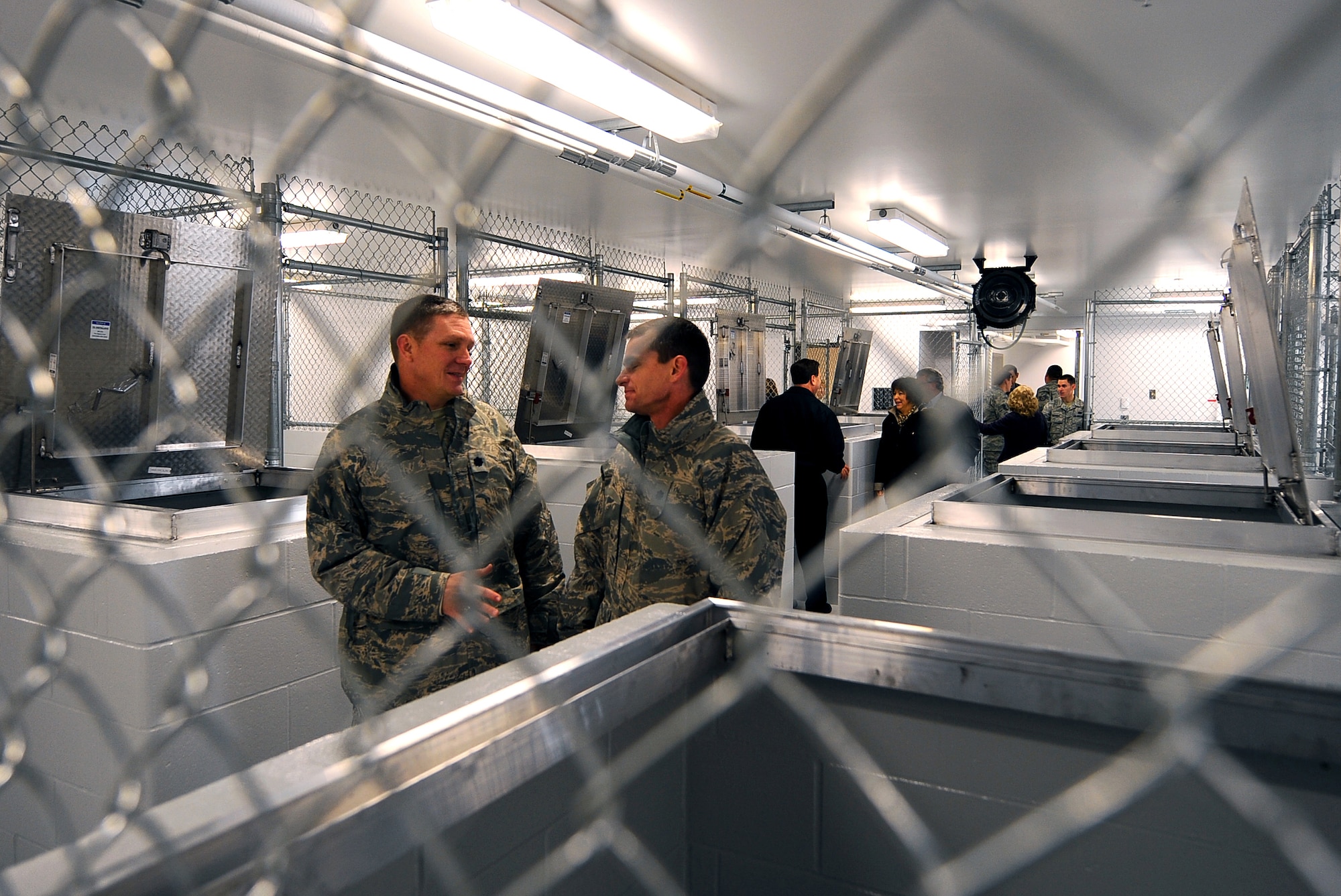 OFFUTT AIR FORCE BASE, Neb.- Numerous guests with Team Offutt were given a tour of the newly remodeled K-9 unit kennels, Nov. 18.  TThe $1.3 million renovation comes well equipped giving the dogs a 10 foot by 14 foot space with private dog house, heated floors, separate isolation kennels for sick dogs and other medical treatment among many other modern amenities. This facility provides a quality and safe environment with ample space for the handlers and their partners which ultimately help the dogs and 55th Security Forces Squadron dog handlers complete the vast array of missions that support Offutt, local police agencies, local community and U.S. Secret Service.
U.S. Air Force photo by Josh Plueger
