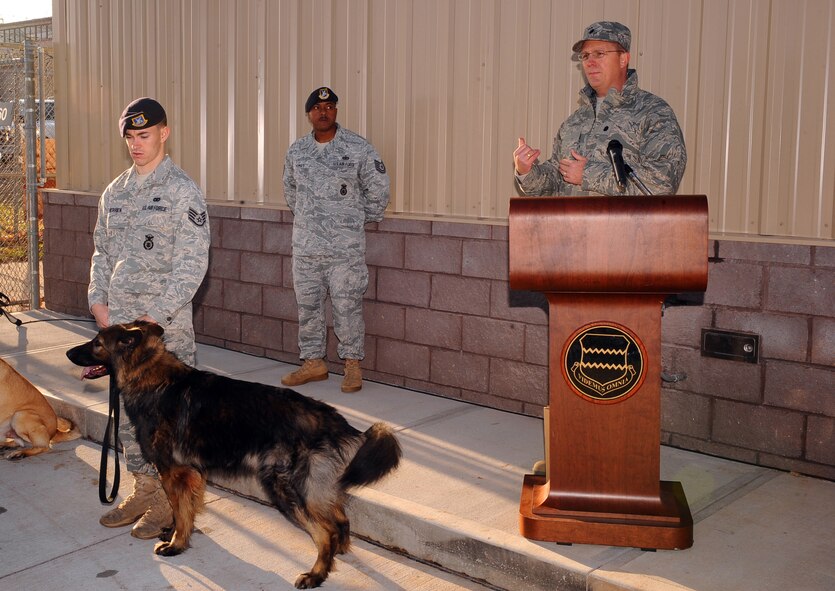 OFFUTT AIR FORCE BASE, Neb. ? Lt. Col. Mitchell Maddox, 55th Mission Support Group deputy commander, gives opening remarks in front of the extensively remodeled K-9 kennel prior to the formal ribbon cutting and tour, Nov. 18.  The $1.3 million renovation project comes well equipped giving the dogs a 10 foot by 14 foot space with private dog house, heated floors, separate isolation kennels for sick dogs and other medical treatment among many other modern amenities.  The 55th Security Forces K-9 section is responsible for searching over 3,000 vehicles a year, securing 54,000 people, protecting and $9 billion in assets.U.S. Air Force photo by Josh Plueger