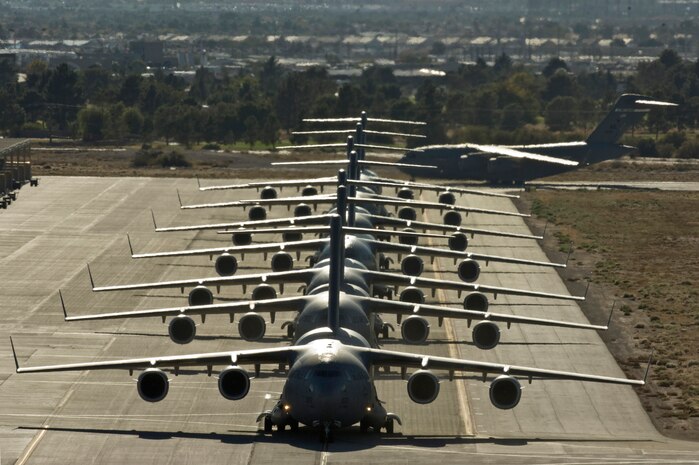 NELLIS AIR FORCE BASE, Nev. --  C-17 Globemaster III aircraft line up on the Nellis runway during the Mobility Air Forces Exercise held at Nellis and over the Nevada Test and Training Range,  Nov 17. Approximately 40 C-17 Globemaster III and C-130 Hercules cargo aircraft will assemble in aerial formations over the NTTR to conduct air and ground operations as part of the bi-annual, U.S. Air Force Weapons School Mobility Air Forces Exercise.  (U.S. Air Force photo by Airman 1st Class Jamie Nicley) (Released)