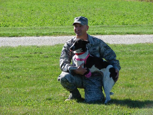 Staff Sgt. Wayne Jenderny of the 148th Fighter Wing, Minnesota Air National Guard visits with Sophie at her home in Eyota, Minn.  Staff Sgt. Jenderny, along with other members of the 148th FW, helped rescue Sophie from Kuwait and found her a new home in the United States. (Photo courtesy of Staff Sgt. Wayne Jenderny, 148th Fighter Wing, Duluth, Minn.).